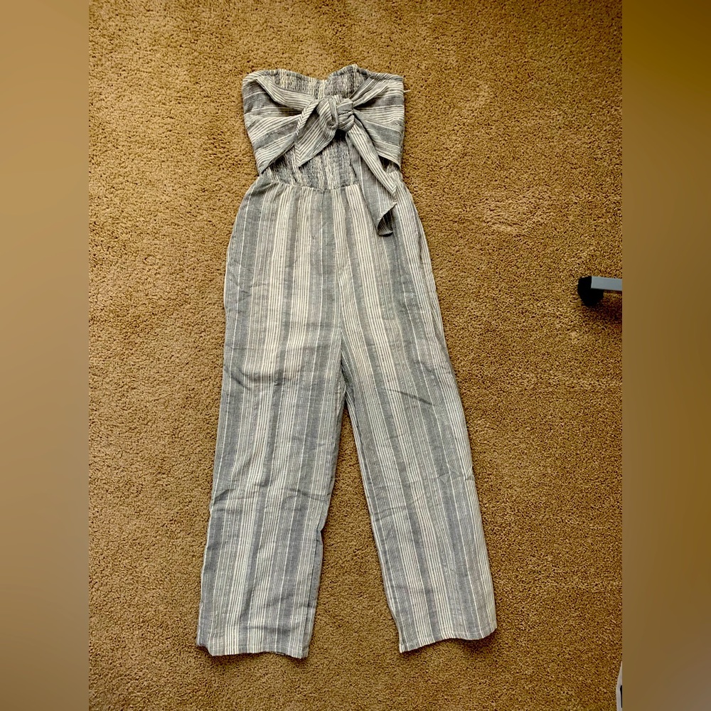 Brand new jumpsuit with tie front stretchable top